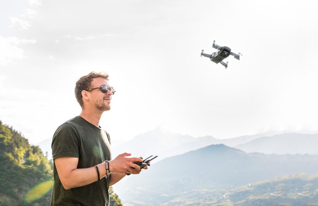 drone, man, drone pilot, copter, quadrocopter, remotely controlled, flying camera, flying object, young man, hobby, photographer, aerial photographs, mountains, nature, aerial photography, drone,