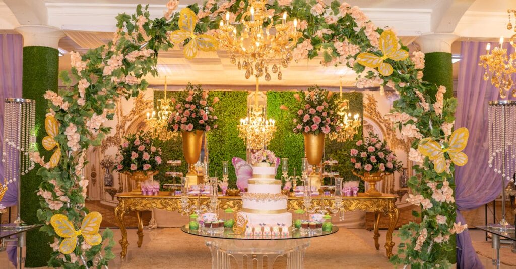 Sophisticated quinceañera celebration featuring floral arches and chandeliers.