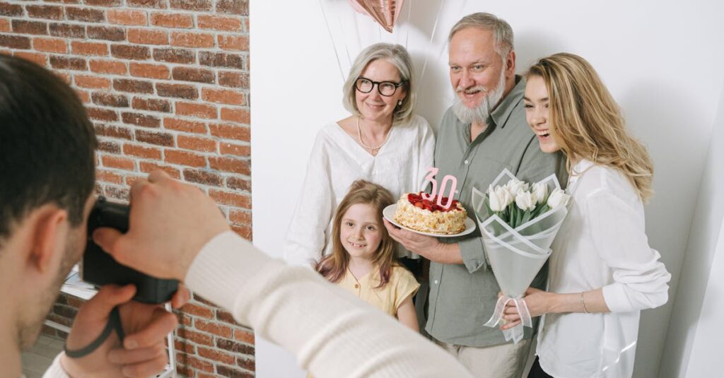 Family celebrating with a birthday cake and balloons, captured in a cheerful indoor setting.